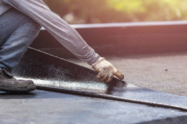 Professional Basement Waterproofing technician working in Fairfield, IL